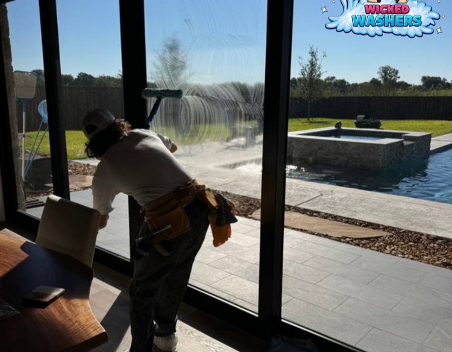 Professional window cleaning by Wicked Washers CTX — view of outdoor pool from clean glass doors in Waco TX